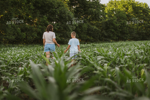 Female Farmer and Son Checking Corn 8742