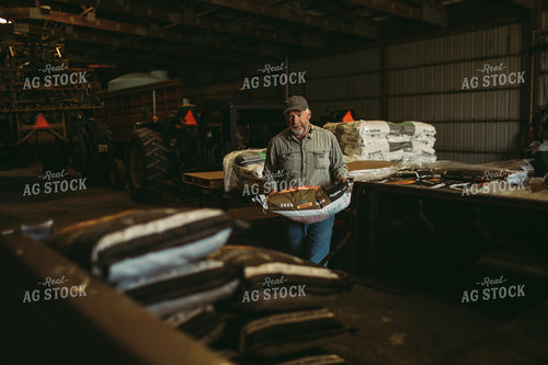 Farmer Loading Seed Bags 4079