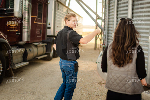 Farmer Dumping Corn 9432