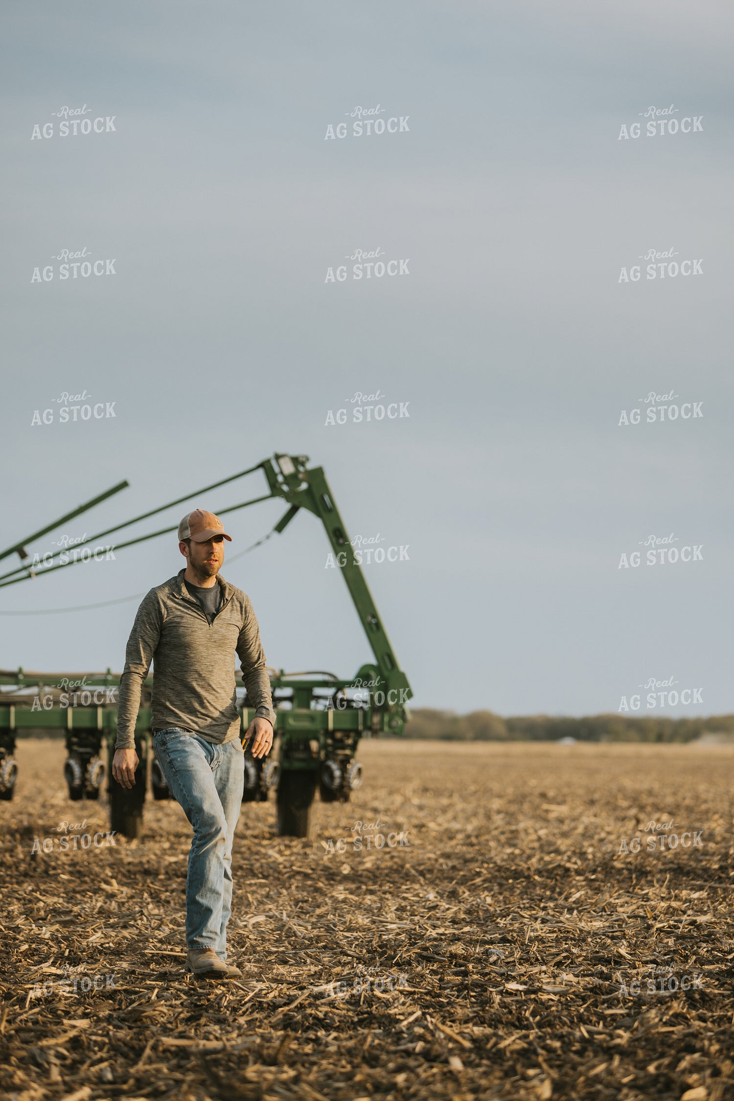 Farmer Walking in Field by Planter 8213
