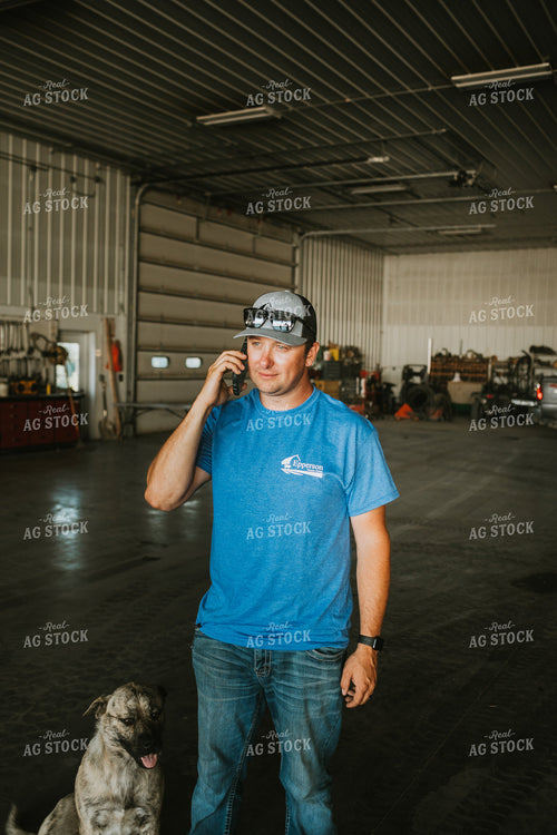 Farmer on Phone in Farm Shop 6209