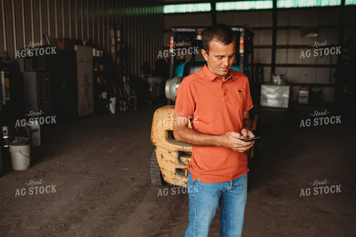 Farmer on Phone in Shop 4520