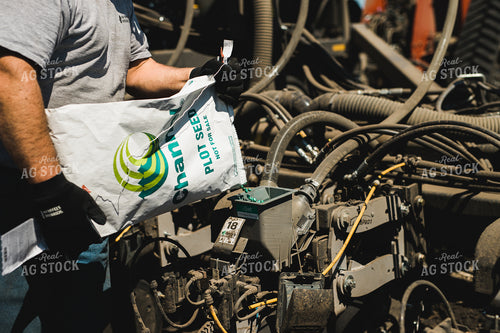 Farmers Pours Seed into Planter 133002