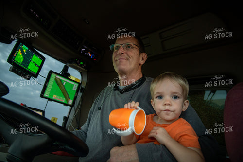 Grandson and Grandfather Farmer in the Combine Cab 25838