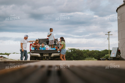 Farm Family Eating Dinner on the Tailgate 8758