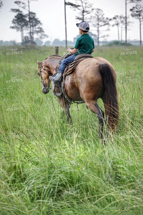 Ranch Kid on Horseback 210008