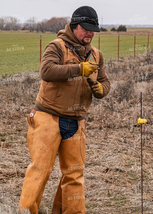 Rancher Fixing Fence 231059