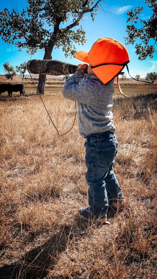 Ranch Kid in Pasture with Angus Cattle 63019