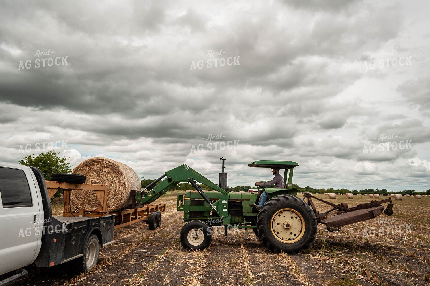 Loading Round Bale of Cornstalks 59028