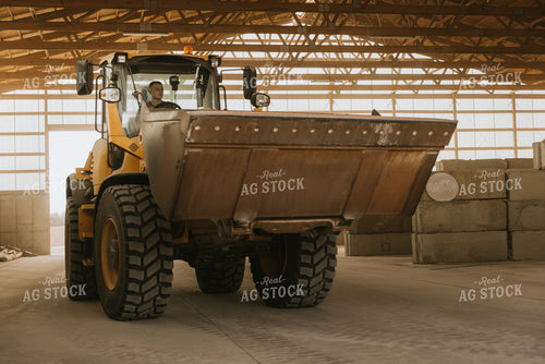 Tractor Loads Dry Feed in Storage Shed 7524