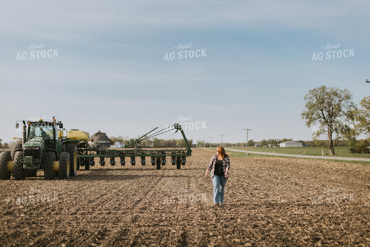 Female Farmer Walking by Planter 8177
