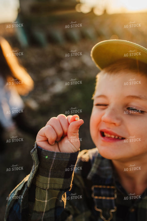 Farm Kid Holding Corn Kernel 115134