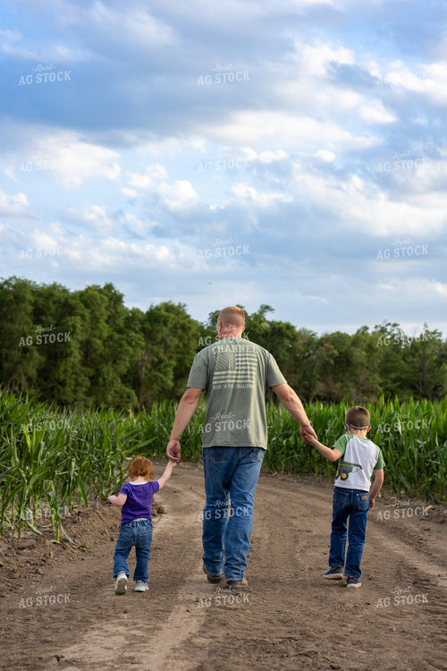Farmer and Farm Kids Checking Corn 65868