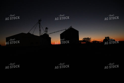 Grain Bin & Tractor Silhouette at Sunrise 25853