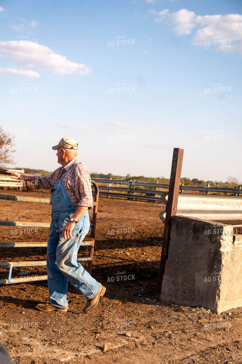 Farmer Opening Gate 115890