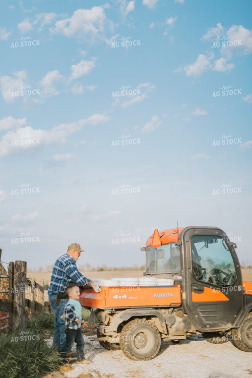 Farmer and Farm Kid Doing Chores 7401