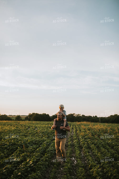 Farmer and Farm Kid in Field 6021