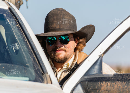 Rancher Getting into Truck 231038