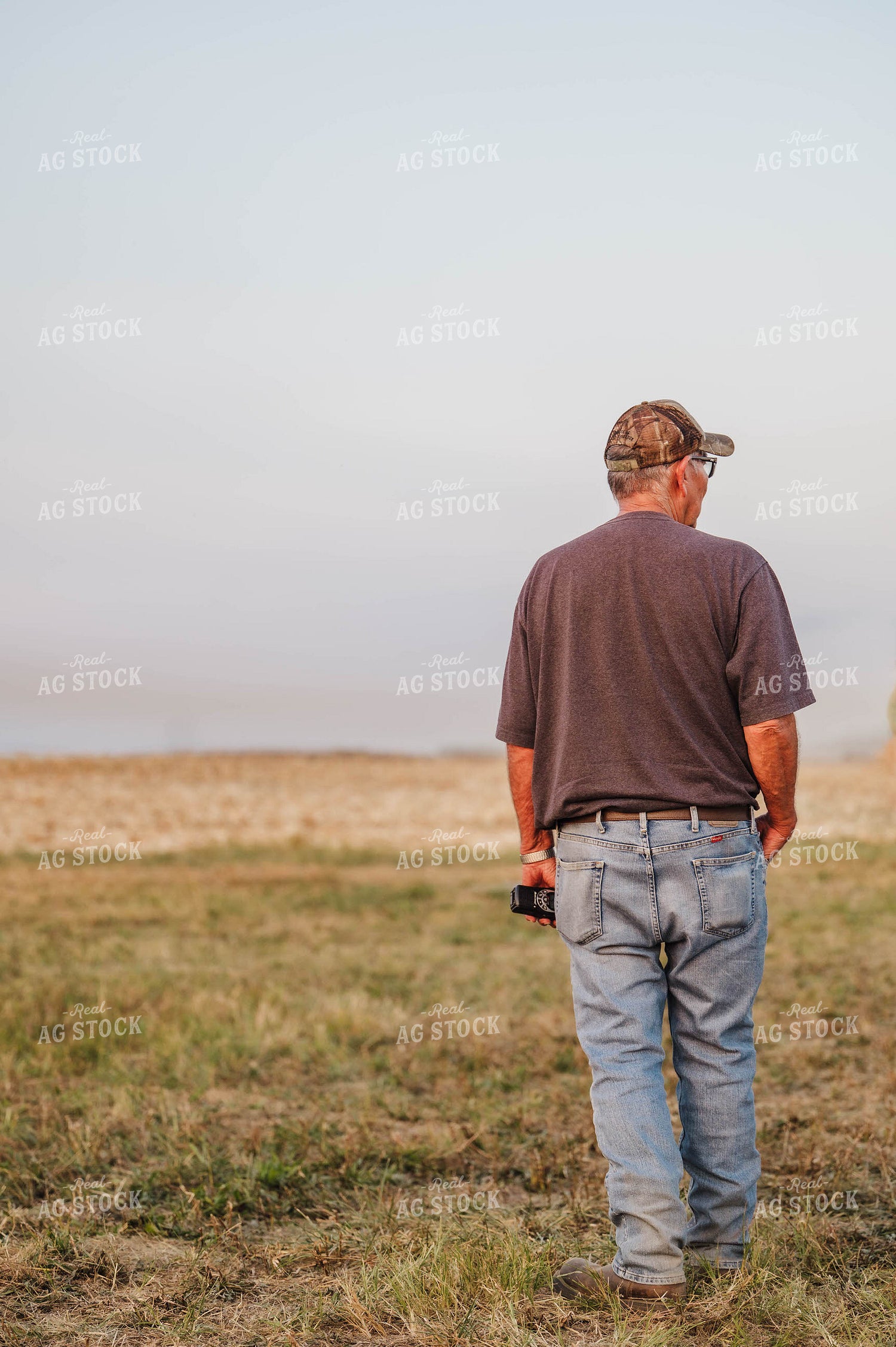 Farmer Standing by Field 115342