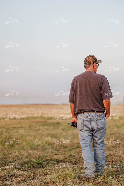 Farmer Standing by Field 115342