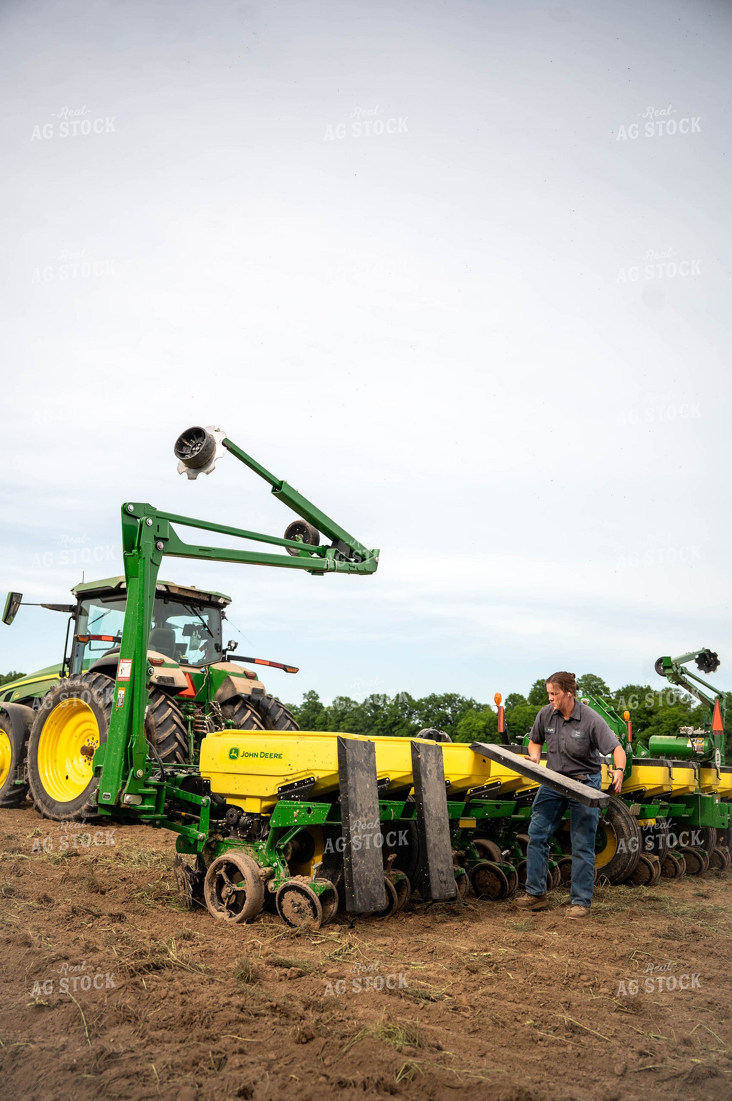 Female Farmer Filling Planter 115647