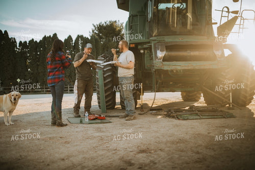 Farm Wife with Phone and Farmers While Working on Combine 5063