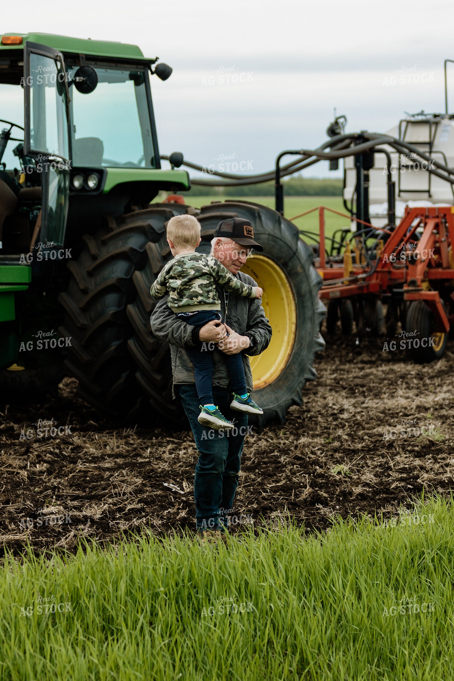 Farmer and Grandson in Field 234013
