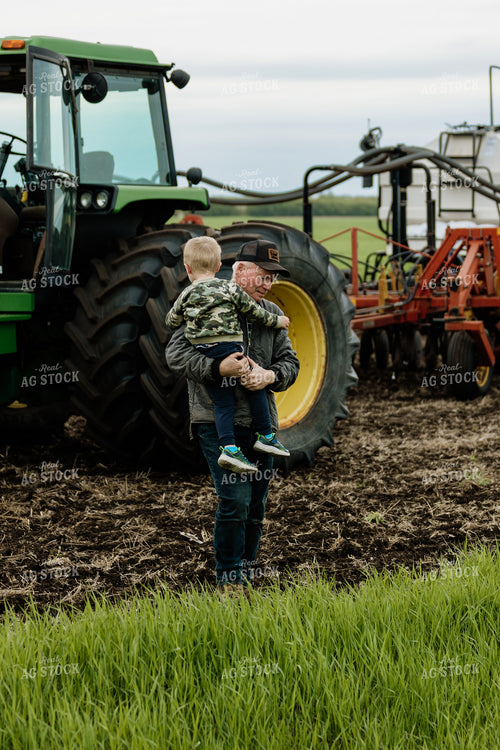 Farmer and Grandson in Field 234013