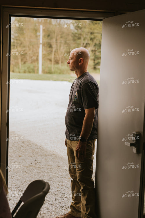Farmer Stands in Doorway 7547