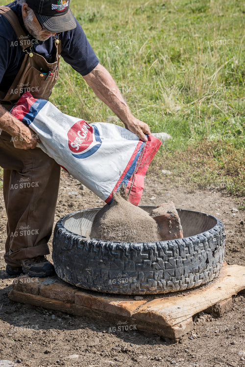 Farmer Pouring Feed 138083