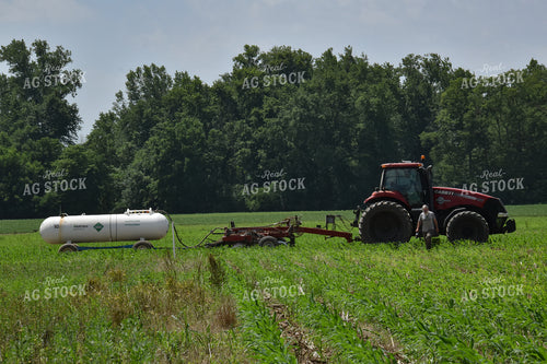 Farmer in Corn field with Anhydrous Applicator 84017