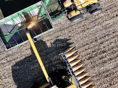 Aerial of Combine Dumping Corn into Wagon 141077