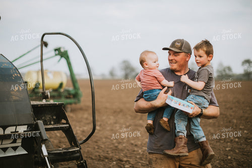 Farmer with Kids During Planting 5644