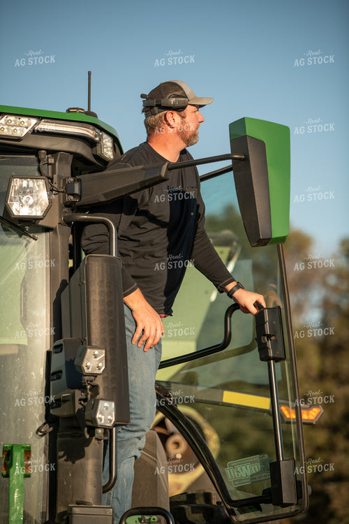 Farmer Climbing Out of Tractor 76463