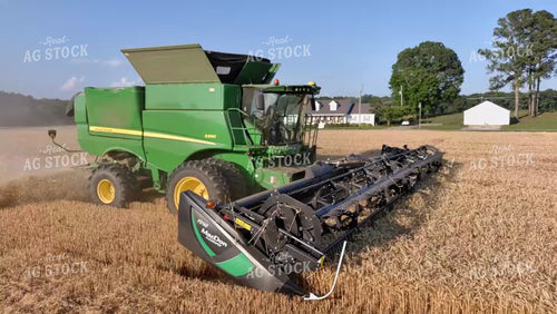 Aerial Wheat Harvest Close Up with Combine 79216
