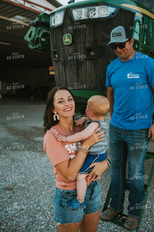 Farm Mom Helping Kids Down from Sprayer 6234