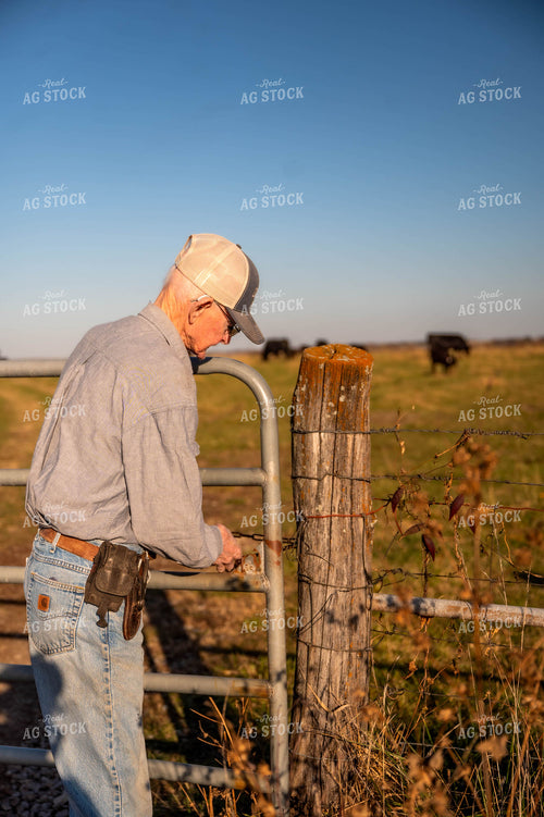 Farmer Closing Fence 115475