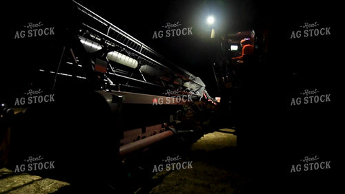 Farmer Sitting in Combine at Night - 543