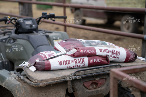 Sacks of Mineral Feed On ATV Carrier in Ranch Setting 65330