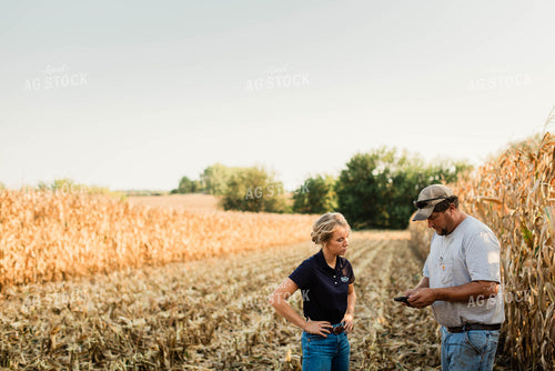 Farmer and Agronomist Using Phone in Field 8295
