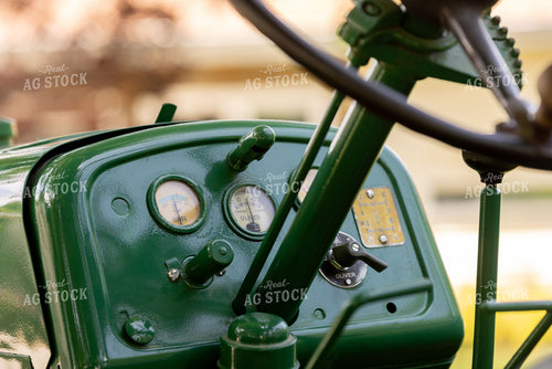 Vintage Oliver Tractor Dashboard Close-Up with Gauges and Steering Wheel 405014