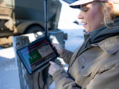 Rancher Looking at Tablet 70206