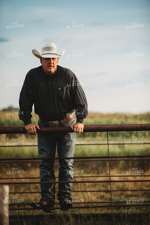 Rancher Standing on Fence 6475