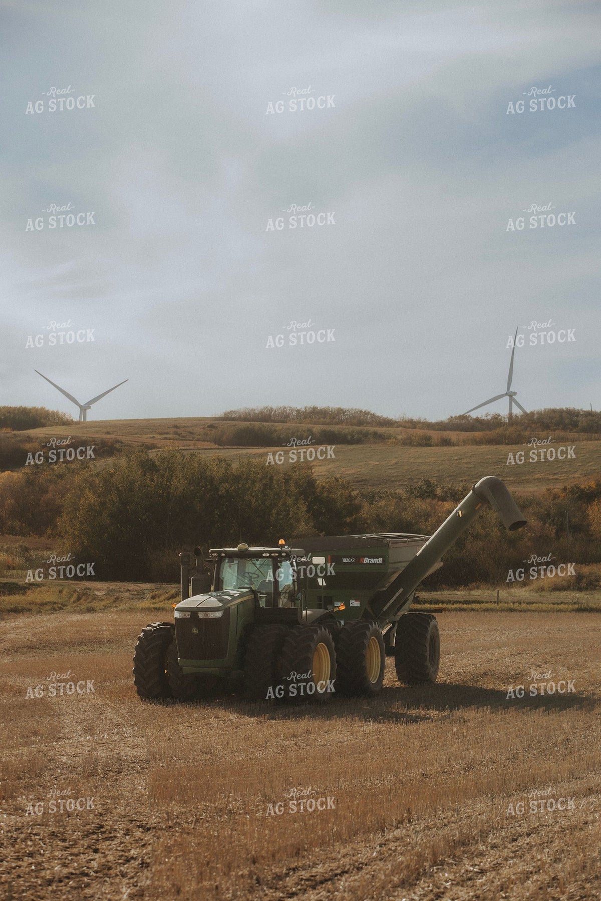 John Deere Tractor and Brandt Grain Cart at Harvest with Wind Turbines 413005