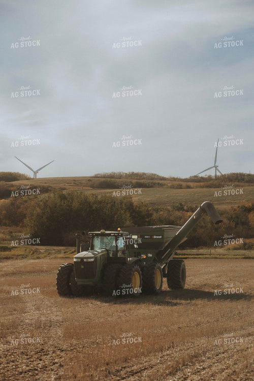 John Deere Tractor and Brandt Grain Cart at Harvest with Wind Turbines 413005