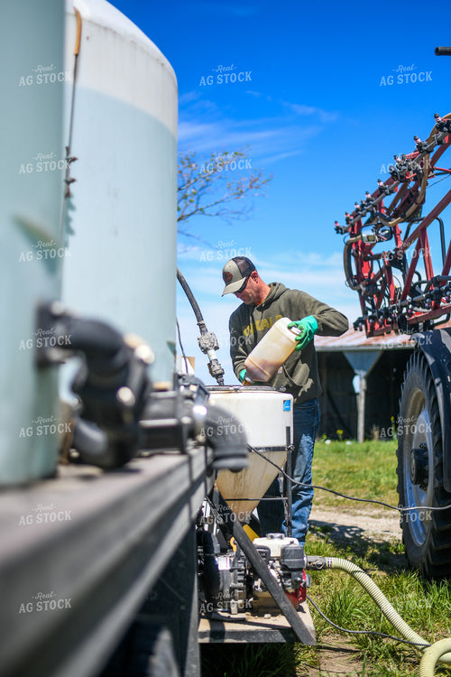 Farmer Mixing Chemicals for Self Propelled Sprayer 191070