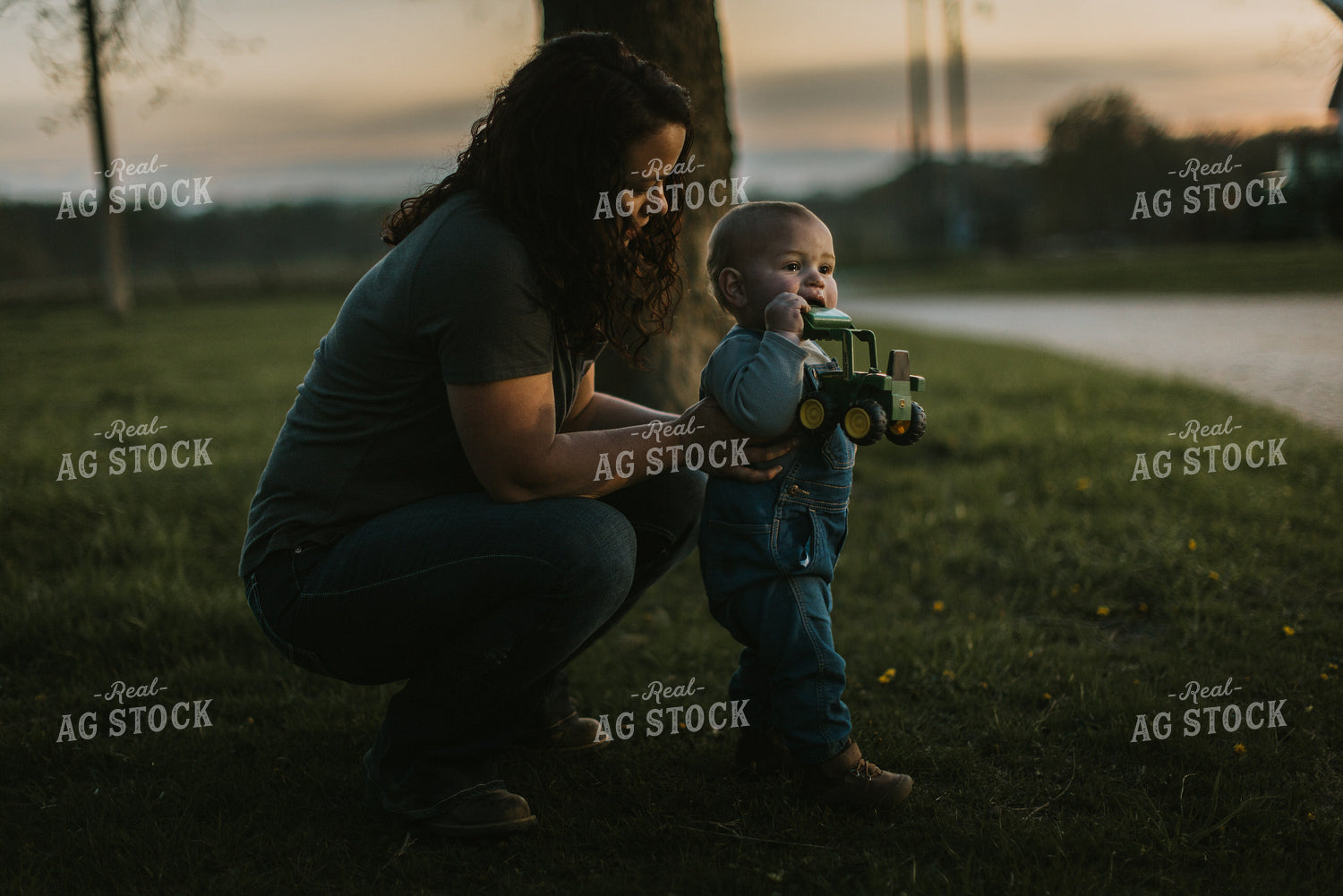 Farm Kid Playing with Toy Tractor 7475