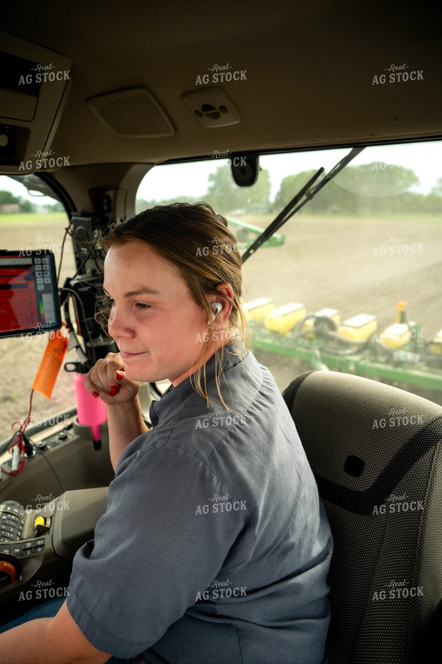 Female Farmer in Tractor Cab 115665