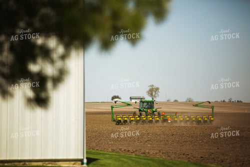 Tractor Pulling Planter in Field 6363