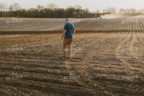 Farmer Walking in Field 7441